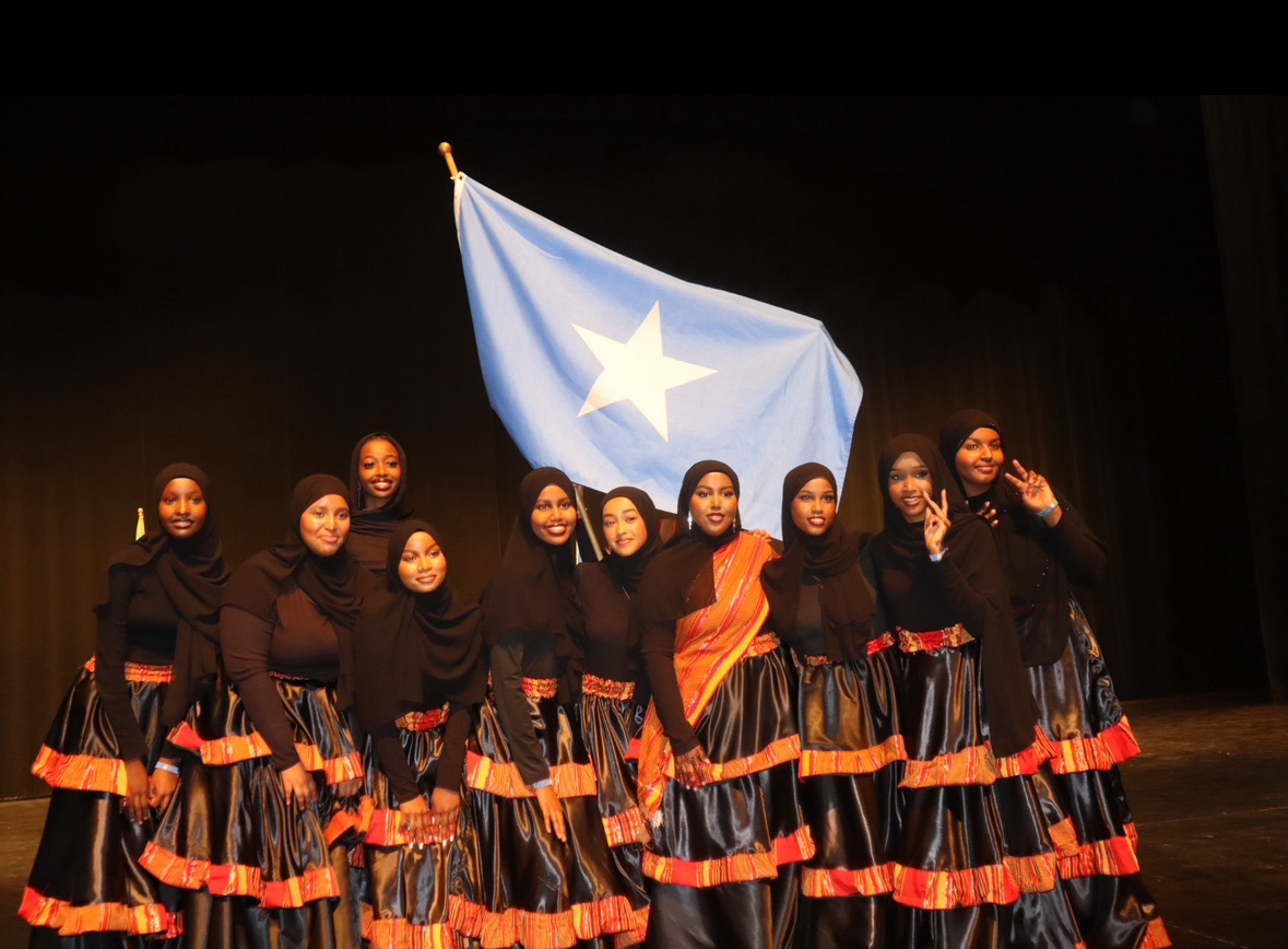 Ayan coordinating a Somali cultural performance with students